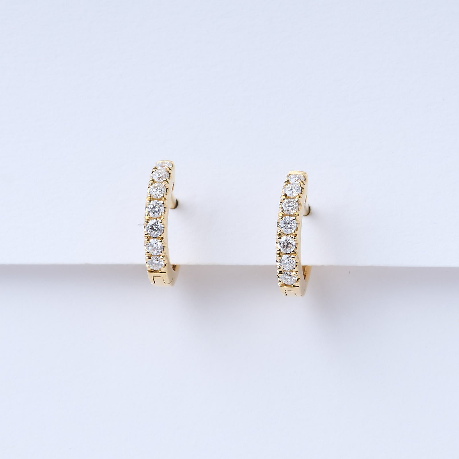 Yellow gold diamond sales huggie earrings